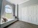 Charming bedroom featuring a window seat with storage and a view of the outdoors at 13013 County Road 561A, Clermont, FL 34715