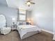 Bedroom featuring soft lighting, neutral tones, and comfortable bedding at 13013 County Road 561A, Clermont, FL 34715