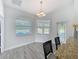 Sunlit breakfast nook with views, granite countertops, and decorative glass door at 13013 County Road 561A, Clermont, FL 34715