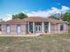 Inviting single-story home with a well-maintained lawn and a welcoming facade at 13013 County Road 561A, Clermont, FL 34715