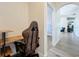 A small work area in the hallway, with a desk and gaming chair at 13013 County Road 561A, Clermont, FL 34715