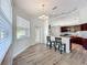 Kitchen with a breakfast nook, complete with stylish pendant lighting and modern finishes at 13013 County Road 561A, Clermont, FL 34715
