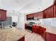 Kitchen featuring stainless steel appliances, granite counters, and breakfast bar seating at 13013 County Road 561A, Clermont, FL 34715