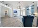 Open-concept living area with tile floors, providing ample space for relaxation and entertaining at 13013 County Road 561A, Clermont, FL 34715