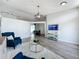 Bright living room with modern furnishings, wood-look tile flooring, and lots of natural light at 13013 County Road 561A, Clermont, FL 34715