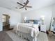 Comfortable main bedroom with a ceiling fan, large rug, and natural light at 13013 County Road 561A, Clermont, FL 34715