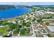 Aerial view of homes and community near a beautiful lake at 1313 Lake Idamere Blvd, Tavares, FL 32778
