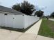 Property featuring a privacy fence, enhancing the home's security and offering a secluded outdoor space at 1313 Lake Idamere Blvd, Tavares, FL 32778