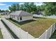 This home features a spacious fenced-in backyard, perfect for outdoor activities and privacy at 1313 Lake Idamere Blvd, Tavares, FL 32778
