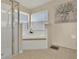 Bright bathroom with a walk-in shower and a garden tub at 1313 Lake Idamere Blvd, Tavares, FL 32778