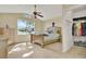 Comfortable bedroom with large window, natural light, and closet at 1313 Lake Idamere Blvd, Tavares, FL 32778