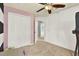 Spacious carpeted bedroom features a closet and entry to another room at 1313 Lake Idamere Blvd, Tavares, FL 32778