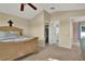 Spacious bedroom features a ceiling fan and natural light at 1313 Lake Idamere Blvd, Tavares, FL 32778