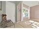 Inviting entryway showcasing a neutral color palette, large window, and front door at 1313 Lake Idamere Blvd, Tavares, FL 32778