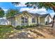 Beautiful single-Gathering home featuring lush landscaping and an inviting front entrance at 1313 Lake Idamere Blvd, Tavares, FL 32778