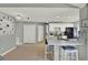 Bright kitchen with white cabinets, breakfast bar and modern appliances at 1313 Lake Idamere Blvd, Tavares, FL 32778