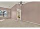 Spacious living area with neutral walls, chandelier, and large window at 1313 Lake Idamere Blvd, Tavares, FL 32778