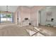 Open living area with natural light, chandelier and neutral color palette at 1313 Lake Idamere Blvd, Tavares, FL 32778