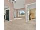 Bright and airy living space features a view to the kitchen at 1313 Lake Idamere Blvd, Tavares, FL 32778