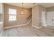 Bright entryway features hardwood floors, natural light, and a stylish modern light fixture at 1336 Crystal Lake E Ave, Orlando, FL 32806