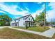 Lovely two-story home boasting a manicured lawn, inviting front porch, and neutral color scheme at 1336 Crystal Lake E Ave, Orlando, FL 32806