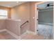 The second floor hallway has wood floors and a view into a bedroom at 1336 Crystal Lake E Ave, Orlando, FL 32806