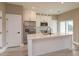 Modern kitchen featuring an island, stainless steel appliances, and stylish white cabinetry at 1336 Crystal Lake E Ave, Orlando, FL 32806