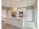Bright kitchen with white cabinetry, stainless steel appliances, and an island with bar seating at 1336 Crystal Lake E Ave, Orlando, FL 32806