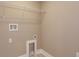 The laundry room includes a washer and dryer hookup and wire shelving at 1336 Crystal Lake E Ave, Orlando, FL 32806