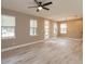 The open living room features wood floors and several large windows at 1336 Crystal Lake E Ave, Orlando, FL 32806