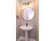 A stylish powder room features modern vanity lights and fixtures at 1336 Crystal Lake E Ave, Orlando, FL 32806