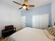This comfortable bedroom features a ceiling fan and a closet with folding doors at 135 Crepe Myrtle Dr, Groveland, FL 34736