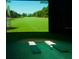 Golf simulator room with high-definition screen for an immersive experience at 135 Crepe Myrtle Dr, Groveland, FL 34736