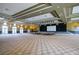 Large hall for events, featuring a stage, lighting, and ample seating at 135 Crepe Myrtle Dr, Groveland, FL 34736