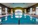 Indoor pool featuring lots of light and trees at 135 Crepe Myrtle Dr, Groveland, FL 34736