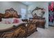 Bedroom featuring an antique bed, decorative dresser with large mirror, and access to closet at 1408 Deuce Cir, Davenport, FL 33896