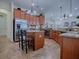 Well-equipped kitchen with ample cabinet space, stainless steel appliances, and a convenient center island at 1408 Deuce Cir, Davenport, FL 33896