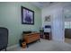 This is an office space with a neutral color palette, a modern desk, and ample workspace at 1408 Deuce Cir, Davenport, FL 33896