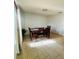 Dining room with wood table and tile flooring with natural light at 1420 Kissimmee Ct, Kissimmee, FL 34759