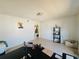 Home office with a black desk and chair with tile flooring at 1420 Kissimmee Ct, Kissimmee, FL 34759