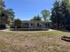 Private backyard highlighting an in-ground swimming pool and green space for outdoor entertaining at 14346 Sw 39Th Ter, Ocala, FL 34473