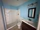 Bathroom with a step in shower, single sink vanity, and toilet at 14346 Sw 39Th Ter, Ocala, FL 34473