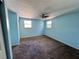 Bedroom with carpet, ceiling fan, dual windows, and closet space at 14346 Sw 39Th Ter, Ocala, FL 34473