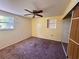 Bedroom featuring a ceiling fan, window, and closet with mirrored doors at 14346 Sw 39Th Ter, Ocala, FL 34473