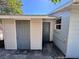 Exterior view of the side of the house and a storage shed with gray doors at 14346 Sw 39Th Ter, Ocala, FL 34473