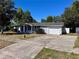 Charming single-story home featuring a well-maintained lawn and a single-car garage and concrete driveway at 14346 Sw 39Th Ter, Ocala, FL 34473