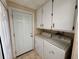 Laundry room with a washer, dryer, and shelving above at 14346 Sw 39Th Ter, Ocala, FL 34473