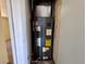 Utility closet with HVAC system and view of carpeted floor in hallway at 14346 Sw 39Th Ter, Ocala, FL 34473