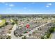Comprehensive aerial perspective showing the home situated in a golf community near a large lake at 1536 Barnwell Pl, The Villages, FL 32162