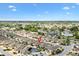 Wide aerial view showing the property's place in the neighborhood with golf and community pool at 1536 Barnwell Pl, The Villages, FL 32162